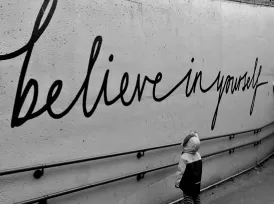 Writing on a wall 'believe in yourself'